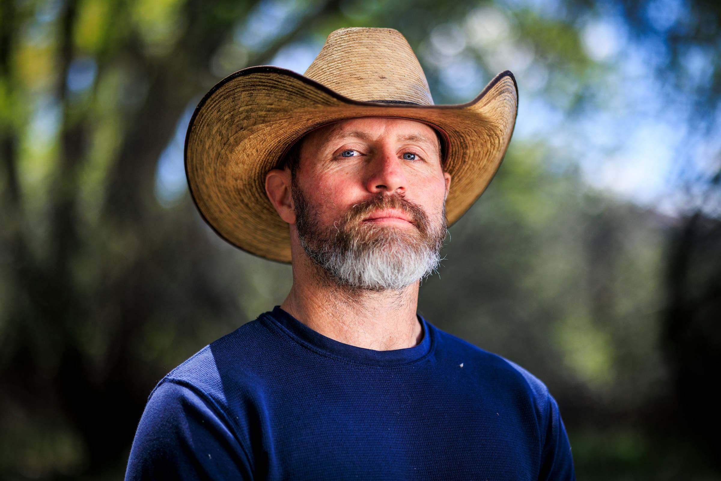 Southwest Non-Lethal Mitigation Specialist for the Colorado Department of Agriculture Jesse Lasater poses for a portrait.