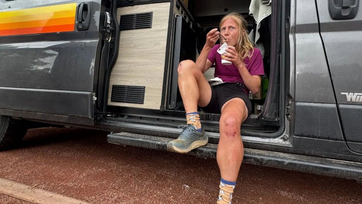Entrekin eating Ramen in a van