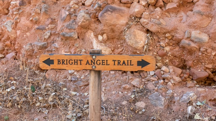 Wooden directional sign of Bright Angel hiking trail at South Rim of Grand Canyon National Park, Arizona, USA. Beginning of trailhead in the wilderness of North America. Wanderlust