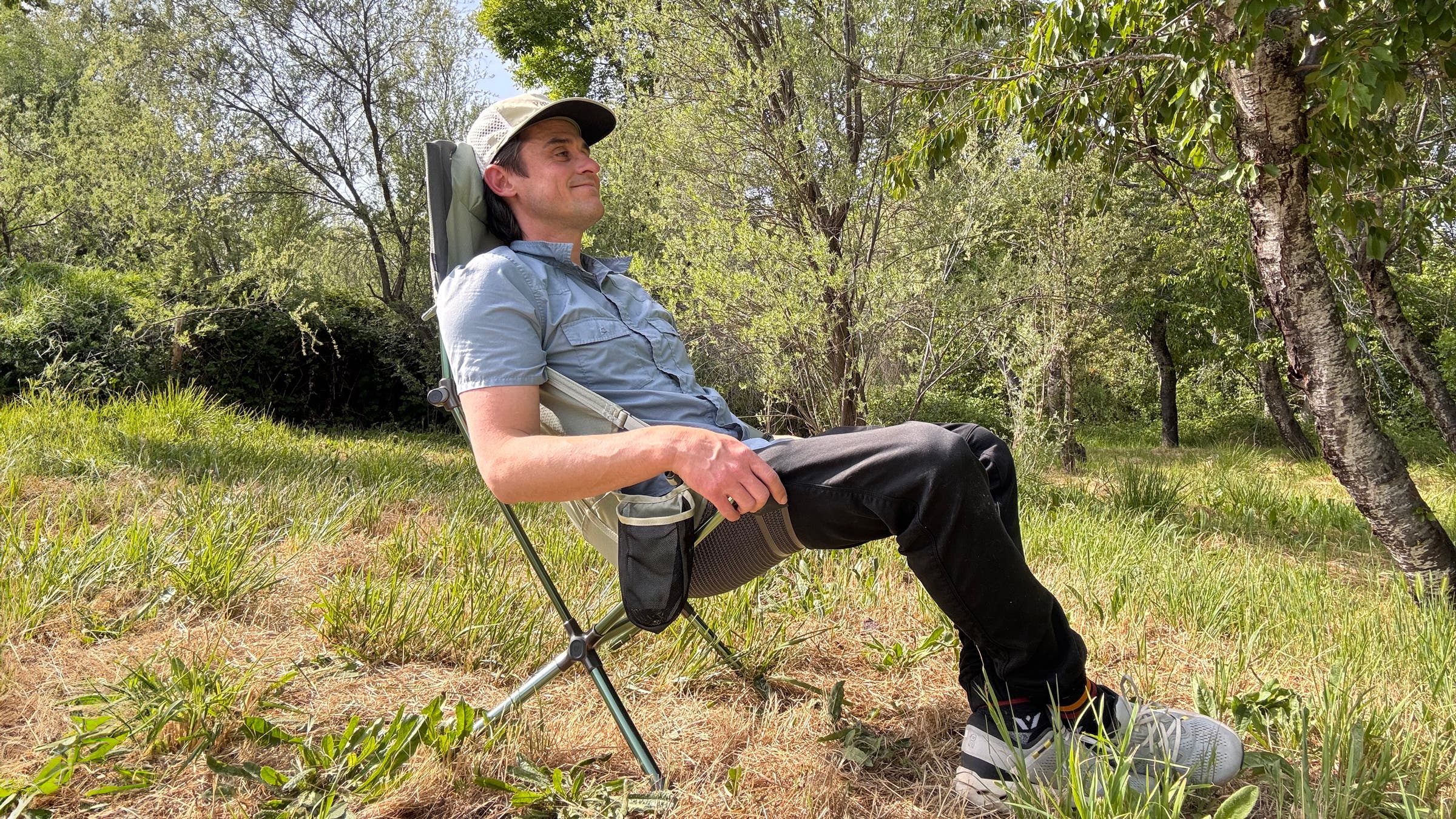 Tester Joe Jackson sitting in the NEMO Satellite Reclining, the best camping chair overall as chosen by Outside