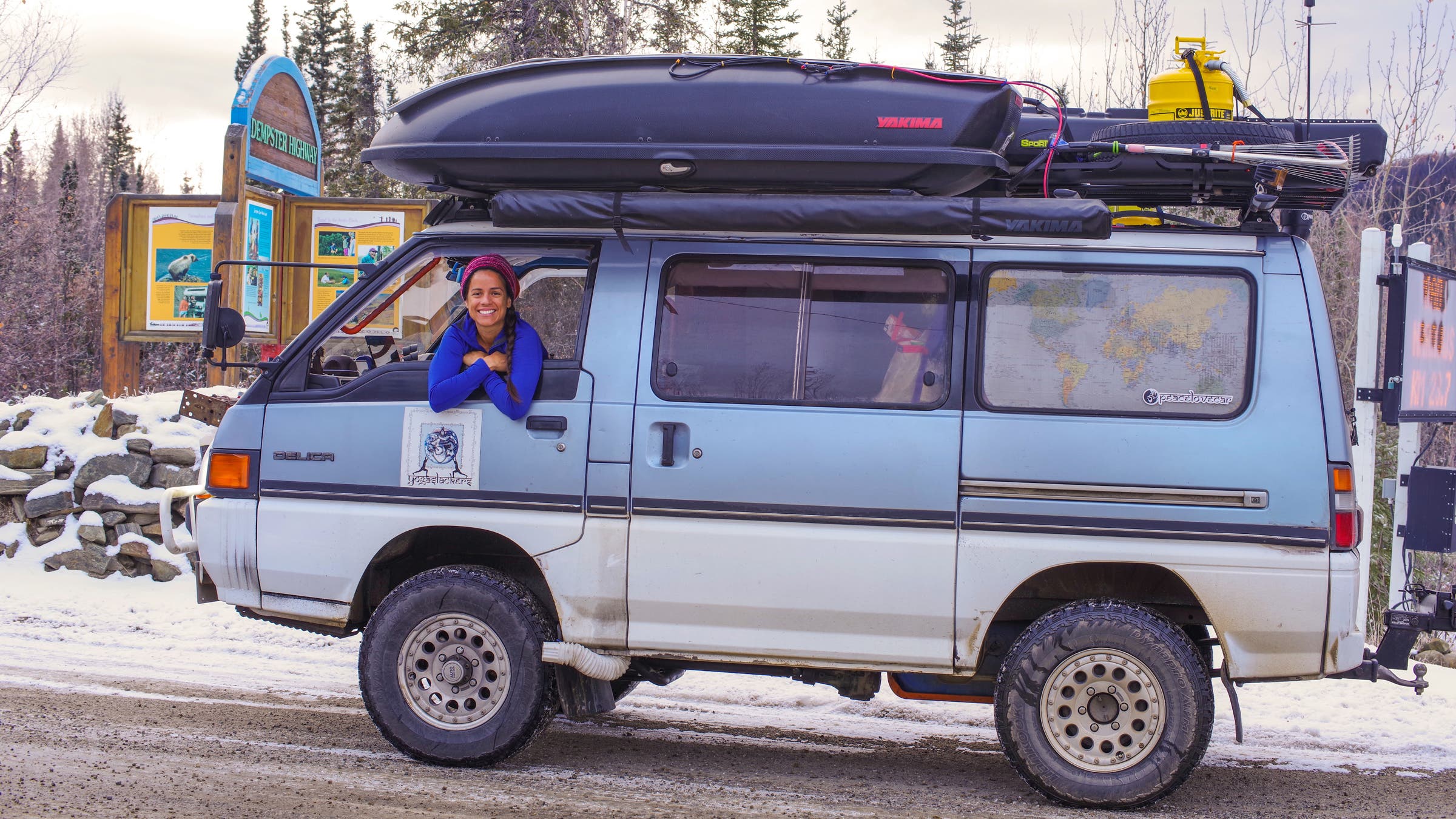 A built-out overlanding Delica with Raquel Hernández hanging out the window