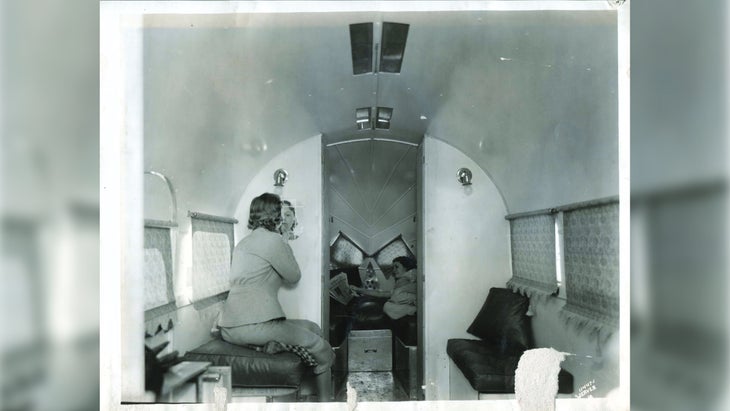 Old photograph of the inside of an Airstream.