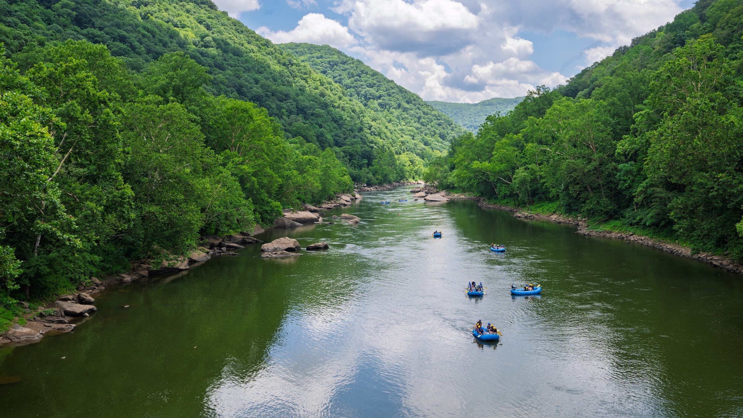 rafters on the New River on a blue-sky day