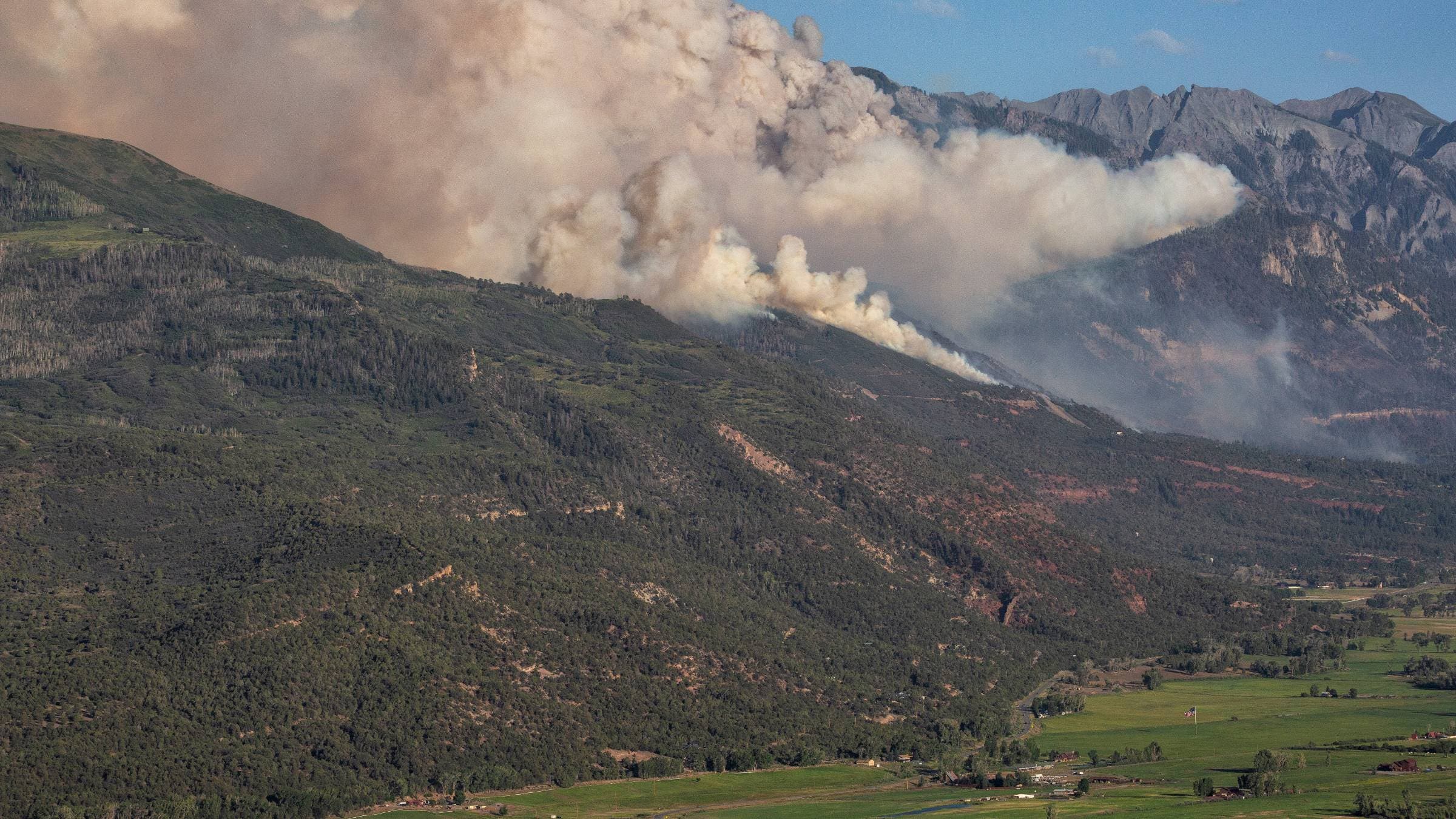 view of the Gold Mountain Fire from a high point in Ridgway, looking south, toward Ouray, Colorado.