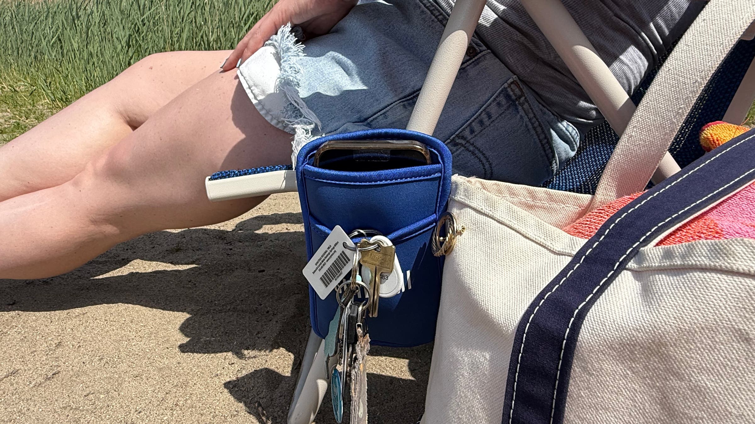 Close-up view of pocket of Shibumi beach chair that holds phone, keys and more