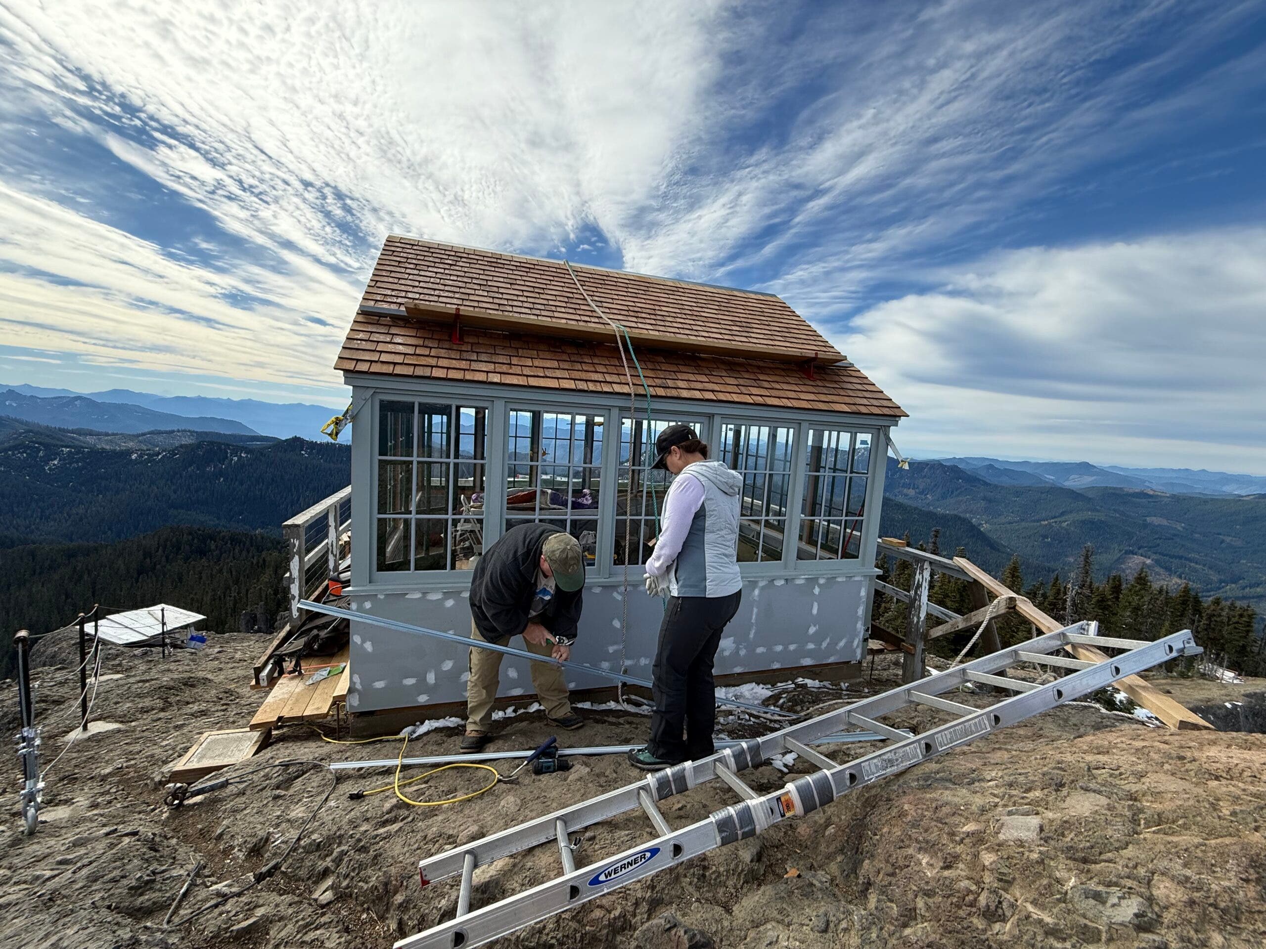 volunteers working on the looking, blue sky can be seen in the background
