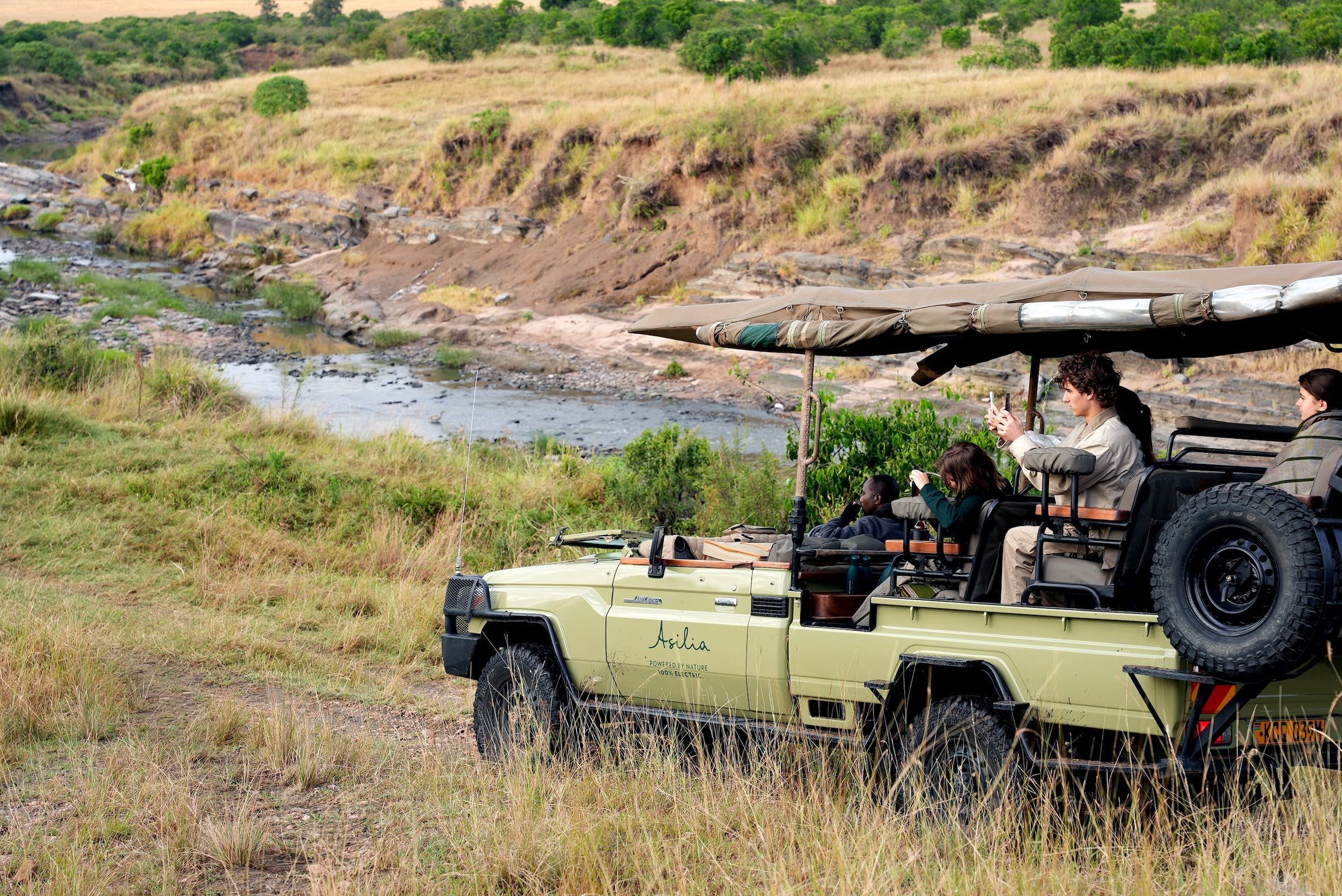 a converted Asilia electric vehicle on safari in Africa