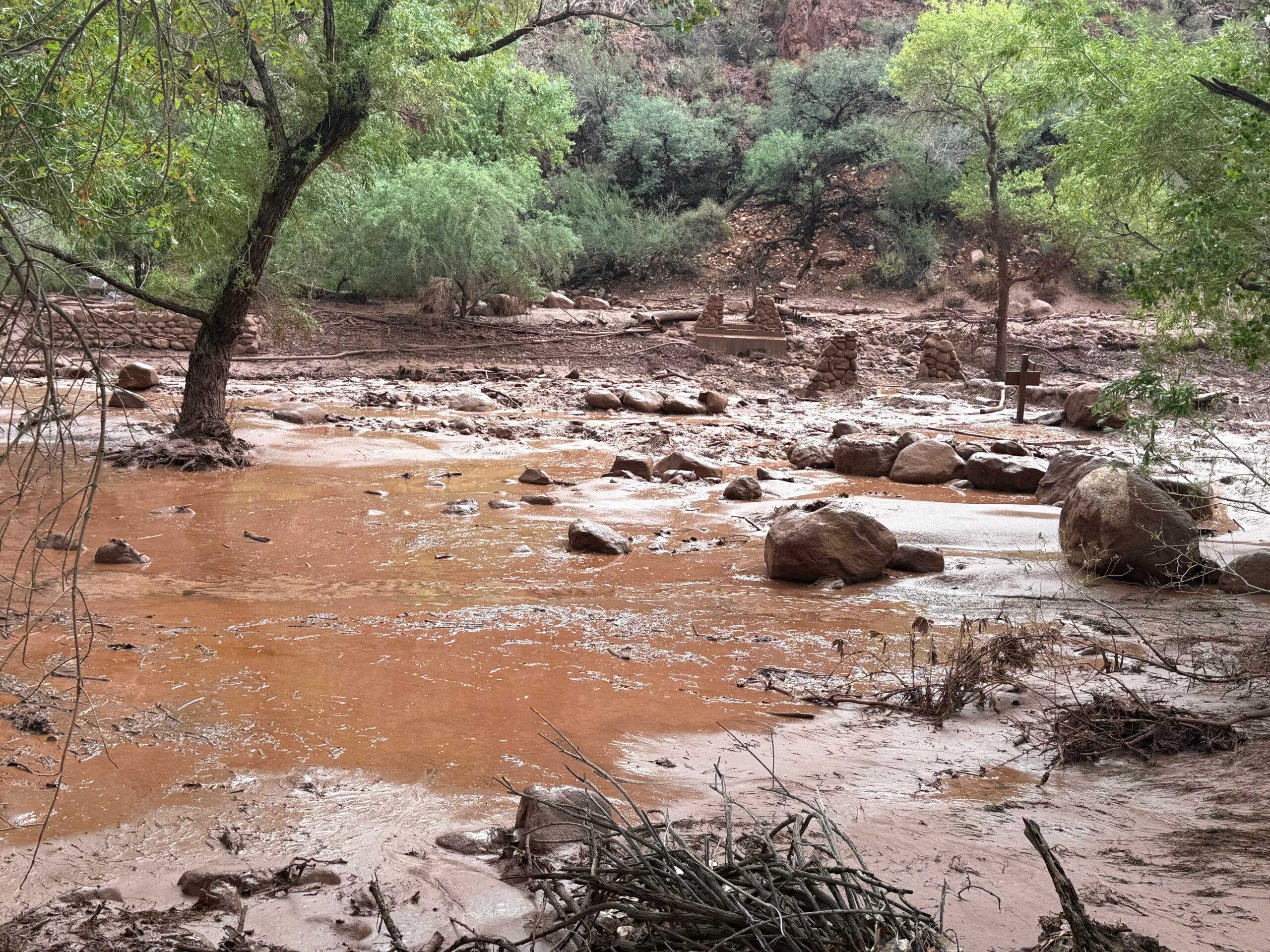 Remnants of stone bridge pylons remain along Bright Angel Creek following a flash flood that destroyed the footbridge on August 29. The flooding caused significant damage to infrastructure throughout the canyon