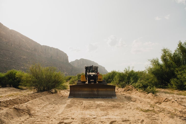 a bulldozer pictured clearing ground near Big Bend National Park