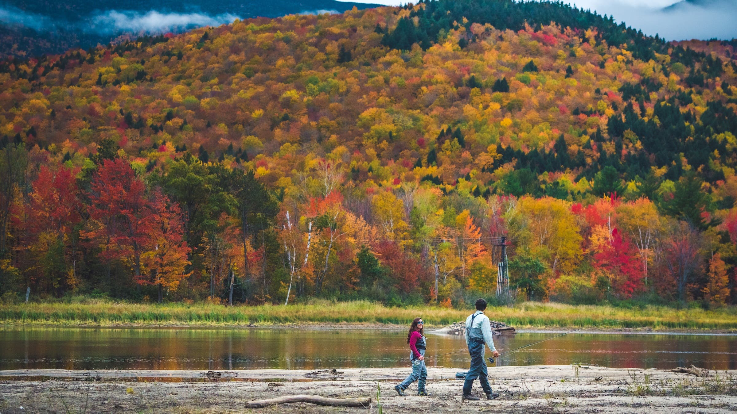 flyfishing surrouned by fall leaves