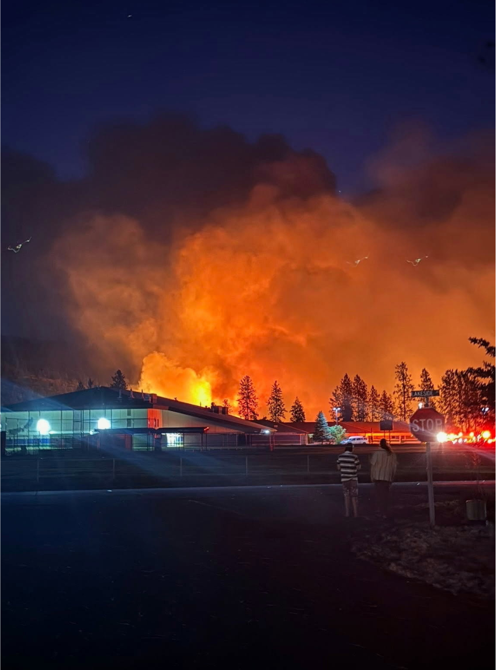 Lakeside High School with flames behind it during the Autumn Lane Fire that started on August 1, 2026.
