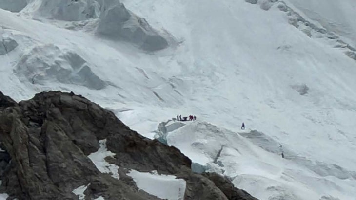 From a distance, climbers in the snow