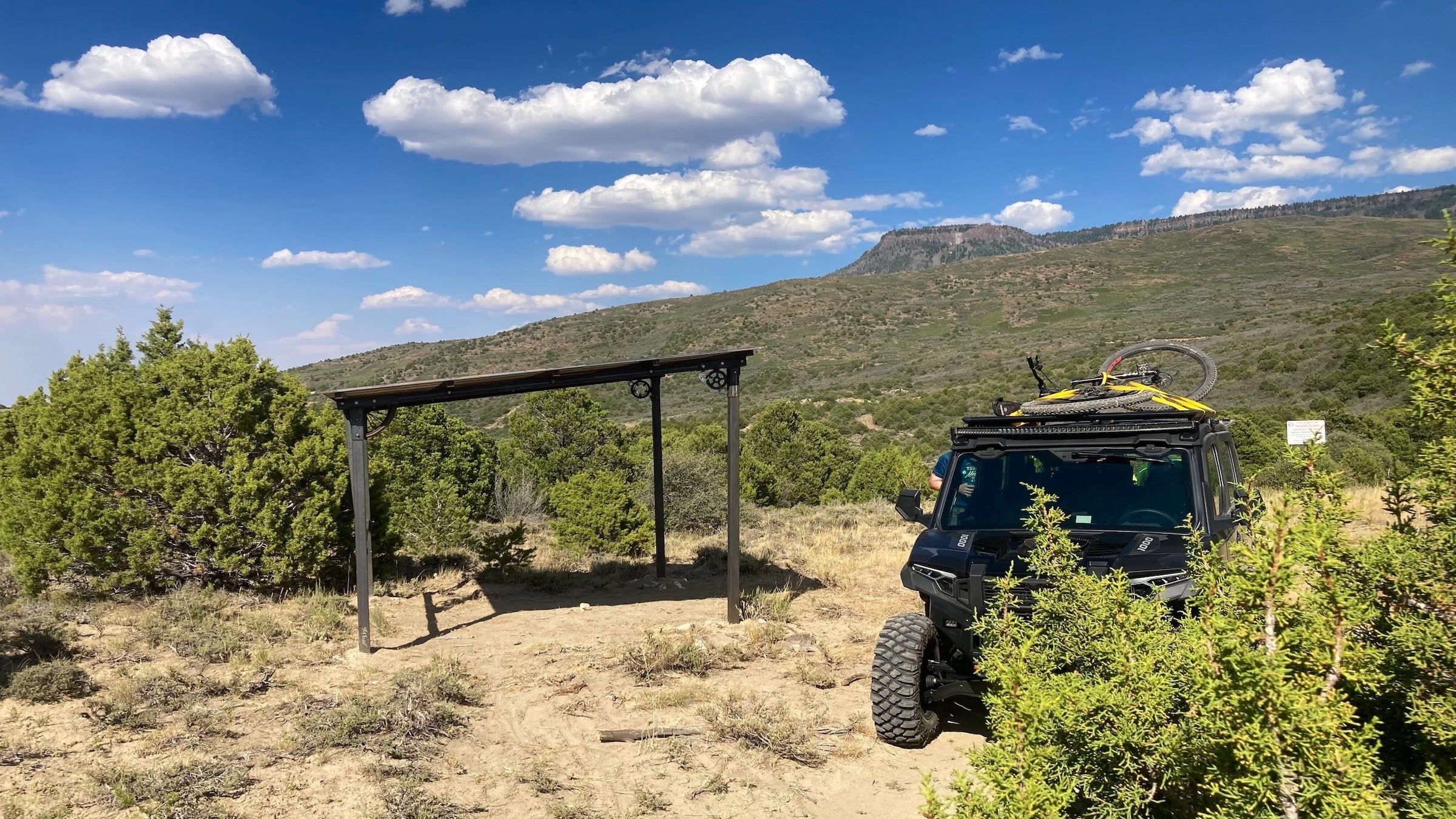 Jeff Higgins memorial shelter in front of grand mesa