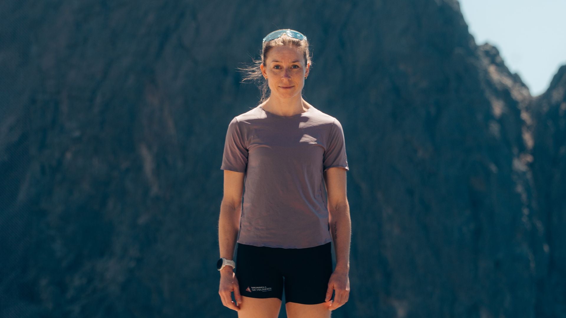 Kalie McCrystal photographed against the backdrop of a mountain