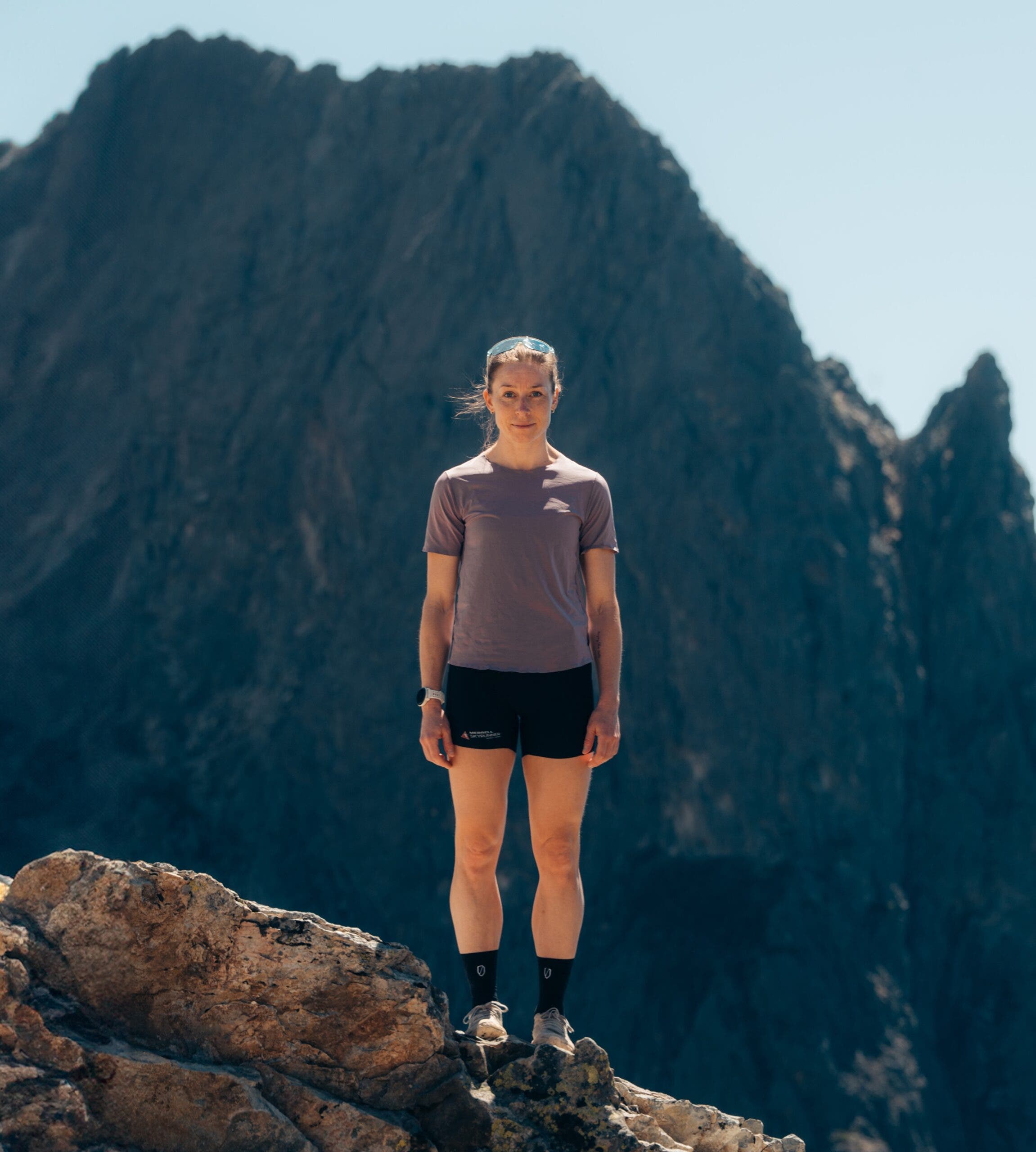 Kalie McCrystal went missing while on September 1, 2026, during a recon run on the Matterhorn. here she is pictured in frount of a mountain wearing black shirts and a purple running shirt