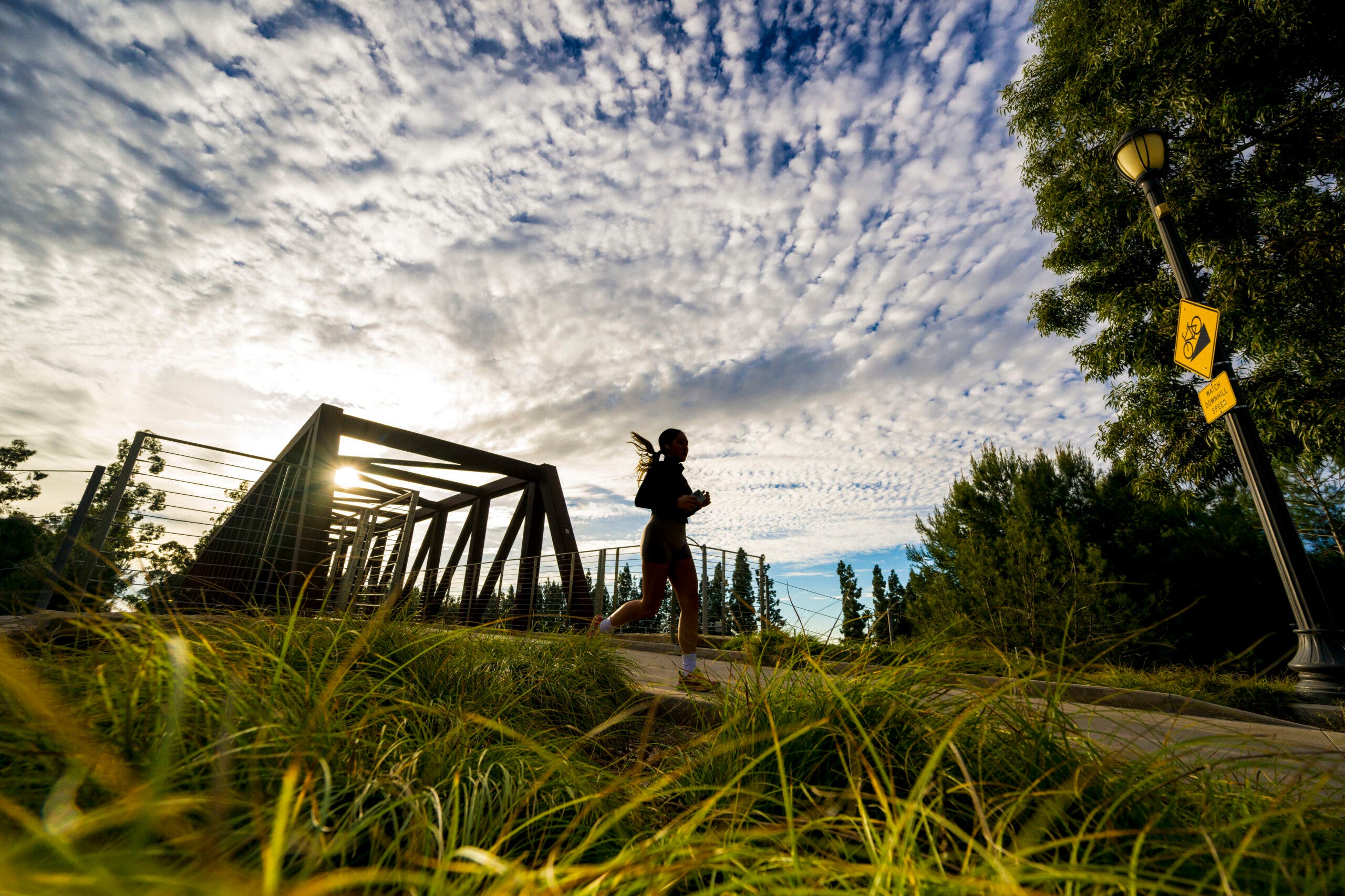 A jogger runs on the Jeffery Open Space Trail in Irvine, CA.
