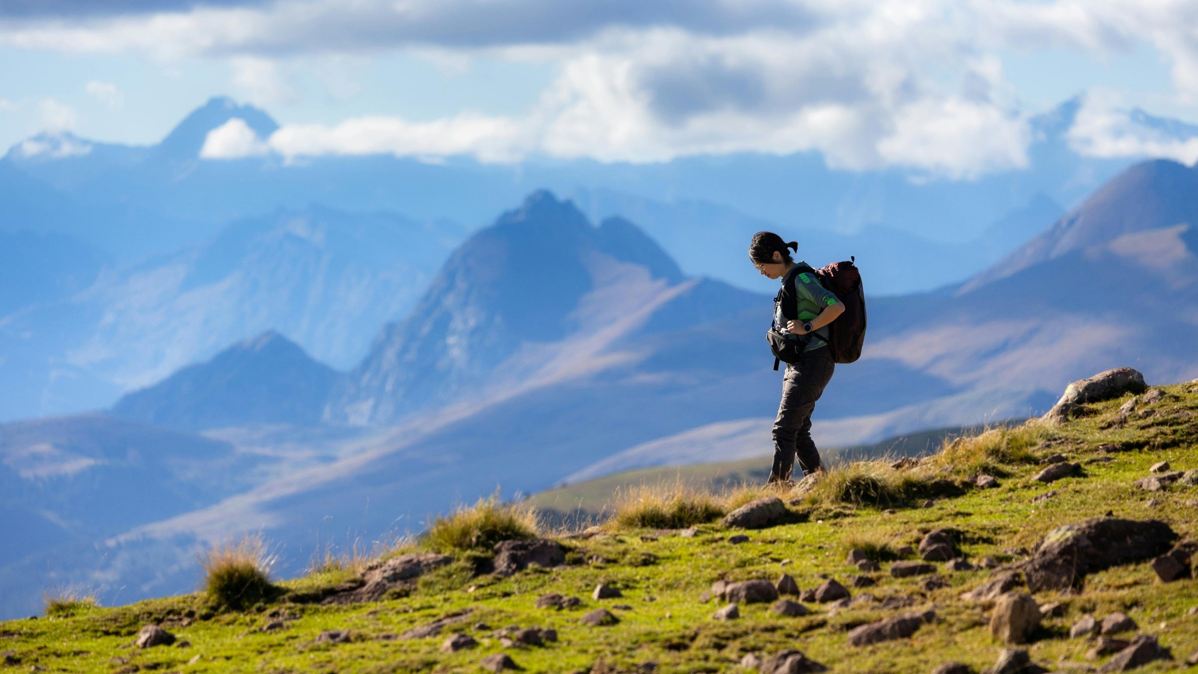 person hiking downhill