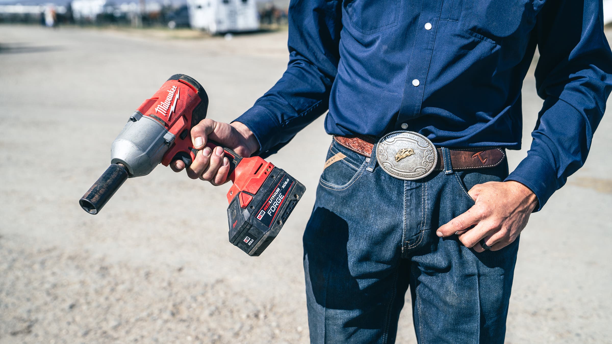 cowboy holding heavy duty impact driver