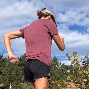 runner going uphill in wool running tee