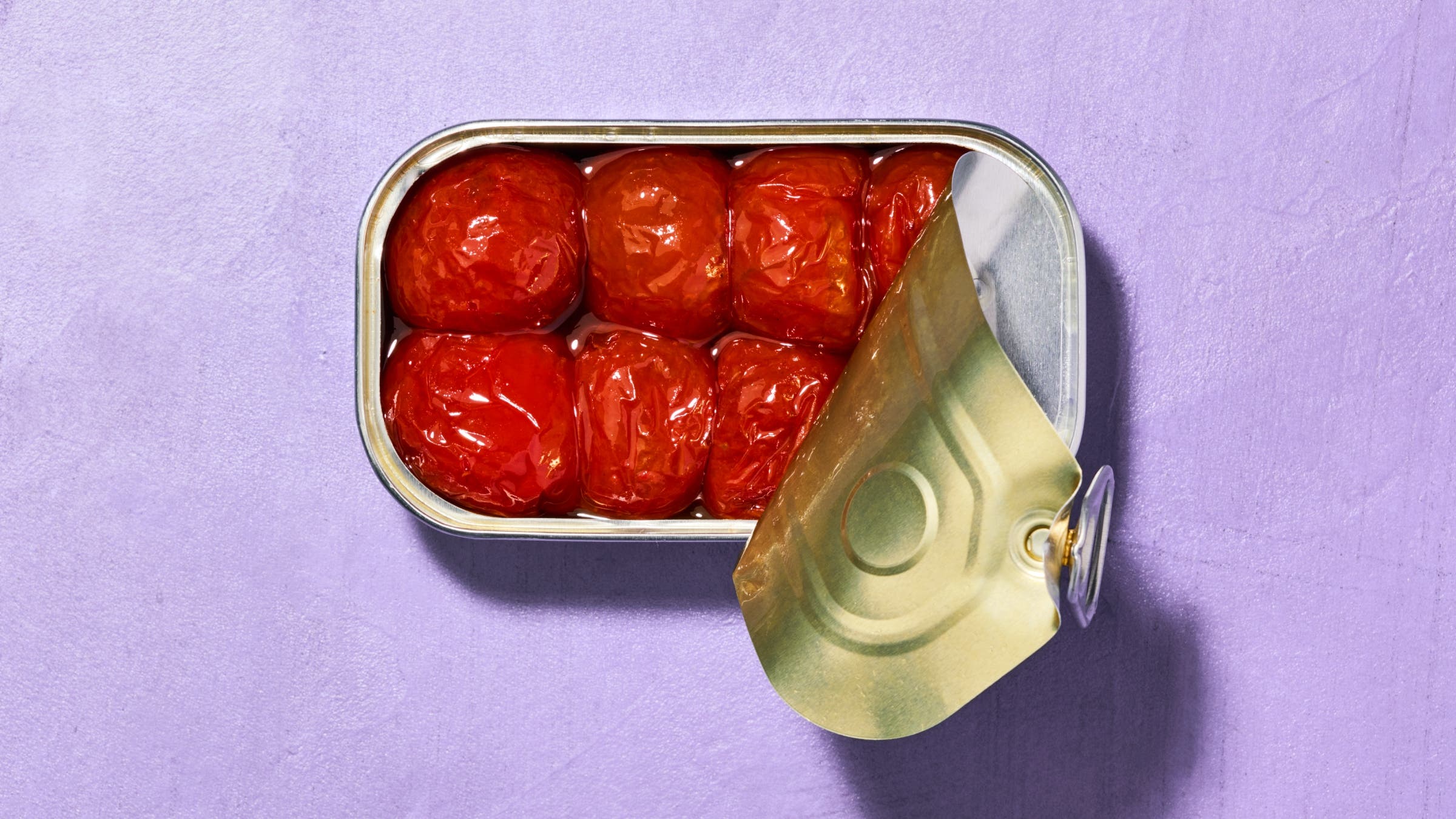 Small tomatoes in a rectangular tin.