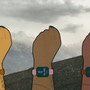 varying skintones wearing fitness watch on wrist