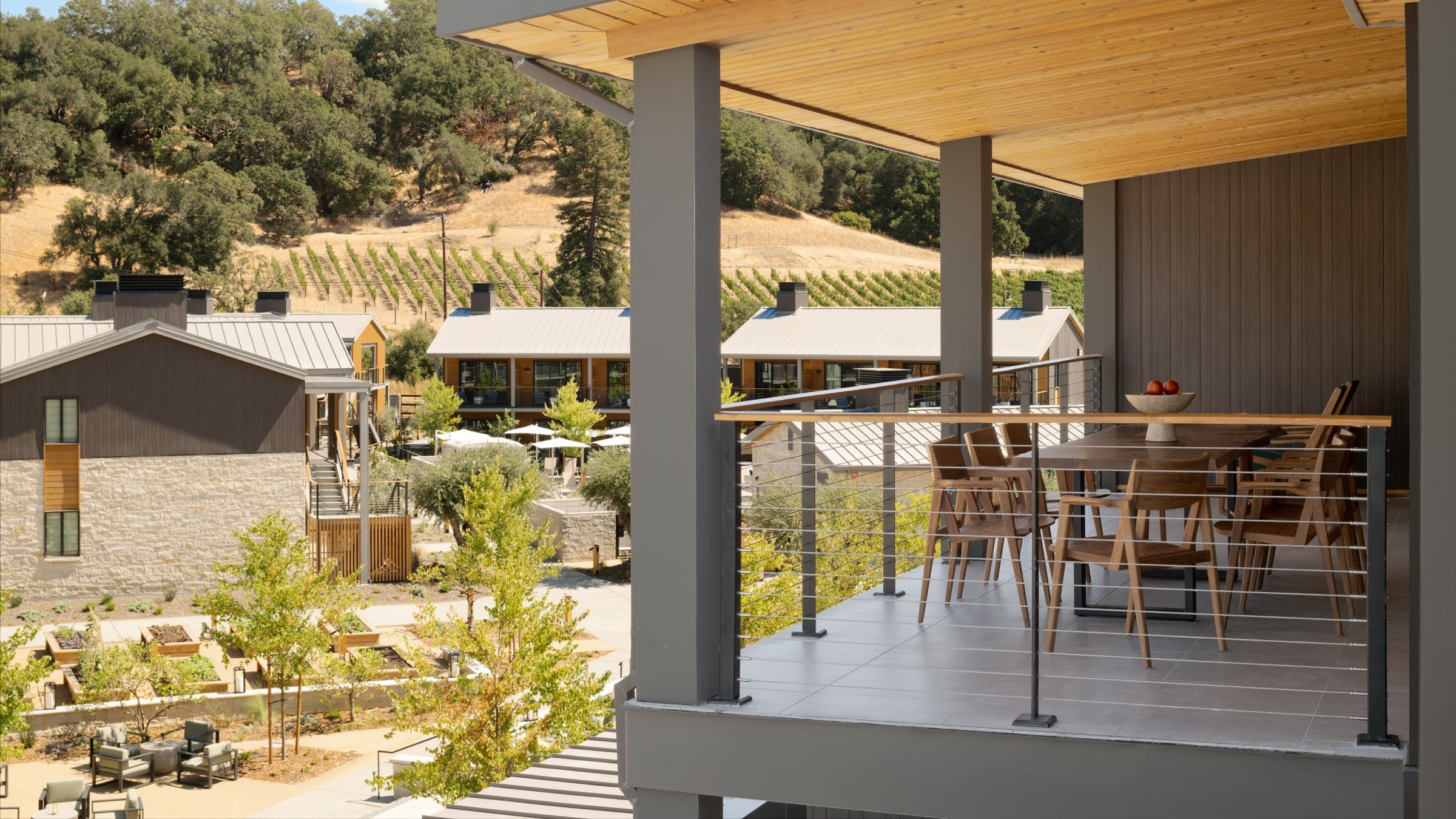 A terrace overlooking a vineyard.