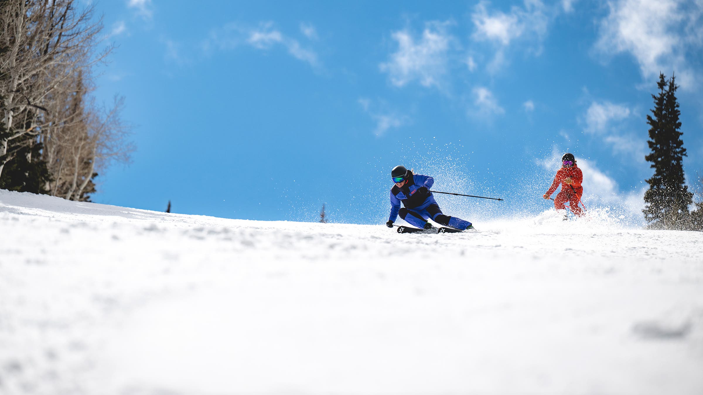 Skier carving on Völkl ski on groomed run
