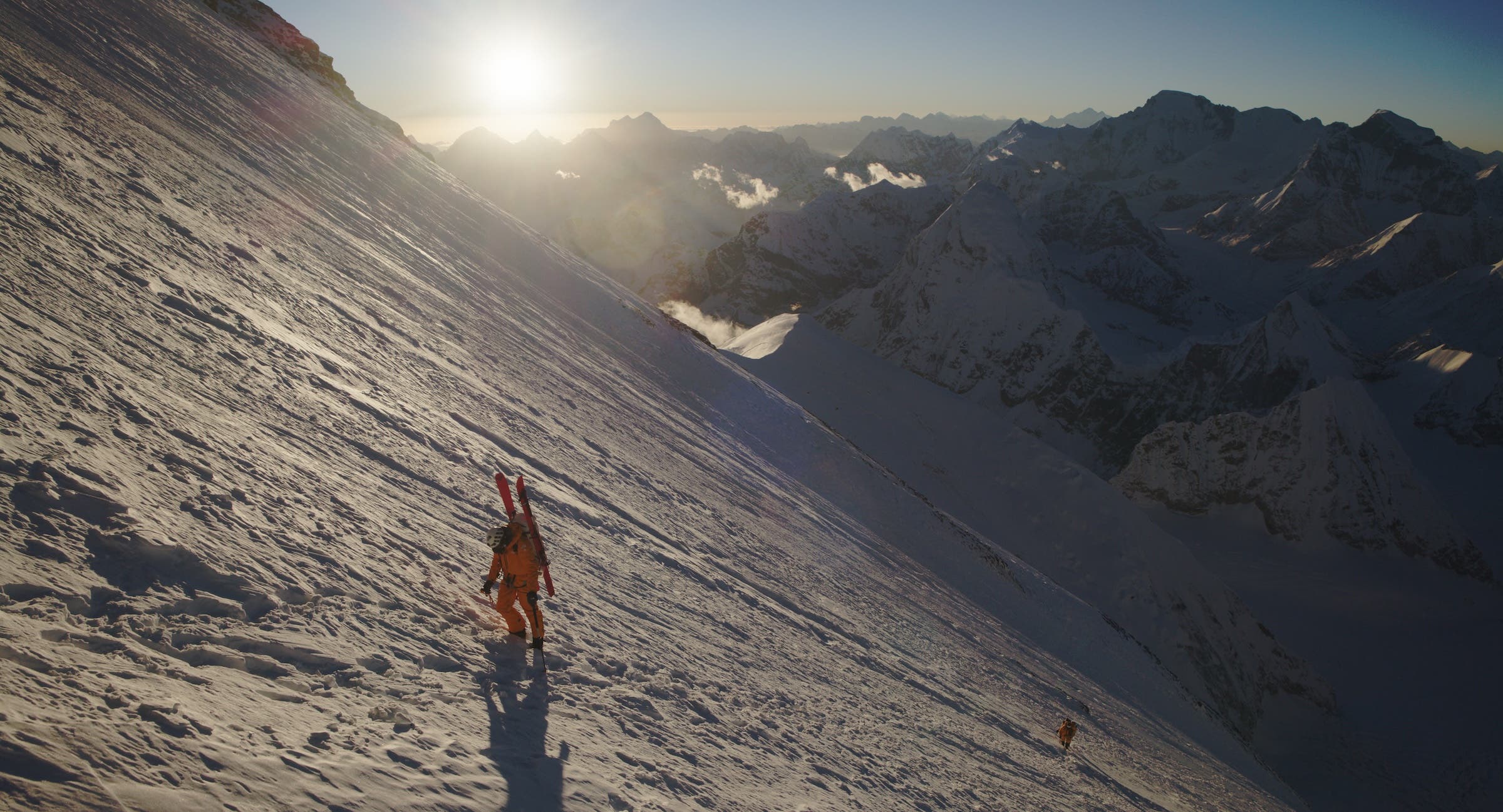 Jim Morrison climbs with a team member behind him