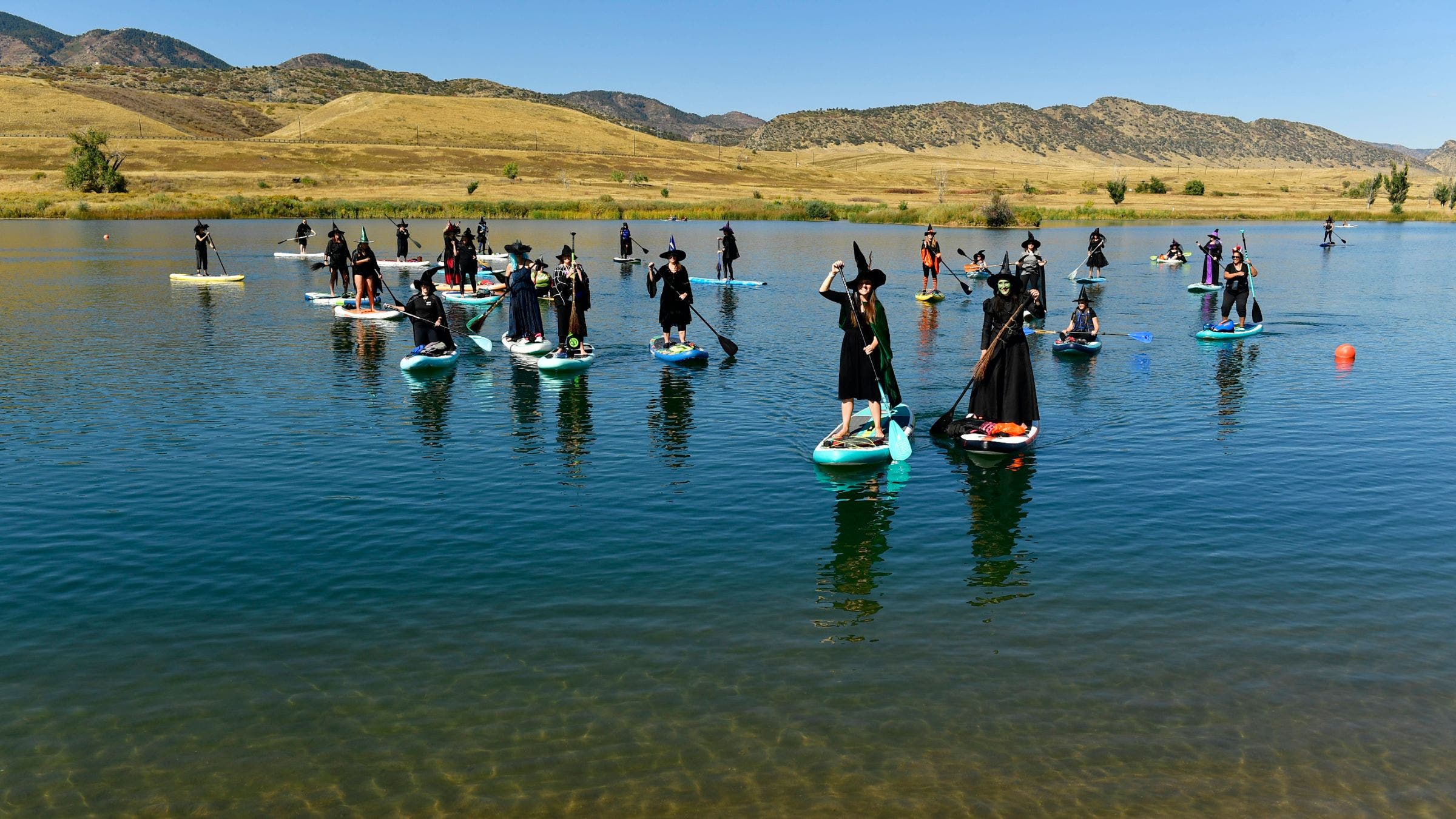 Witches Are Taking Over America's Waterways on Paddleboards This Halloween