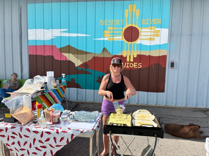 Ryan Dudgeon making breakfast for volunteer rescuers and animal caretakers outside of the Desert River Guides warehouse