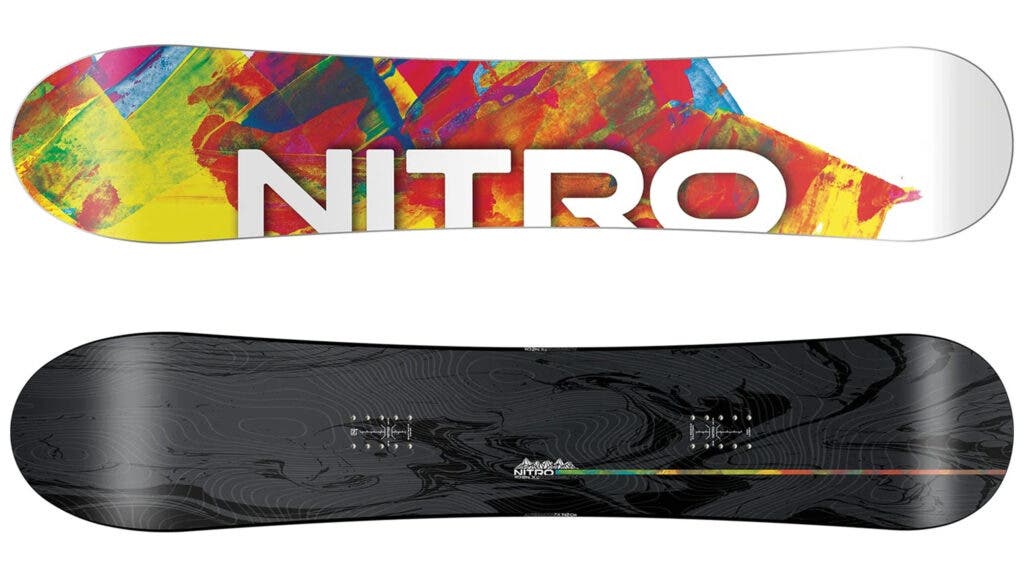 Multicolor paint-splash top sheet with Nitro logo and dark base of the Nitro Alternator FX, our best quiver-killer snowboard