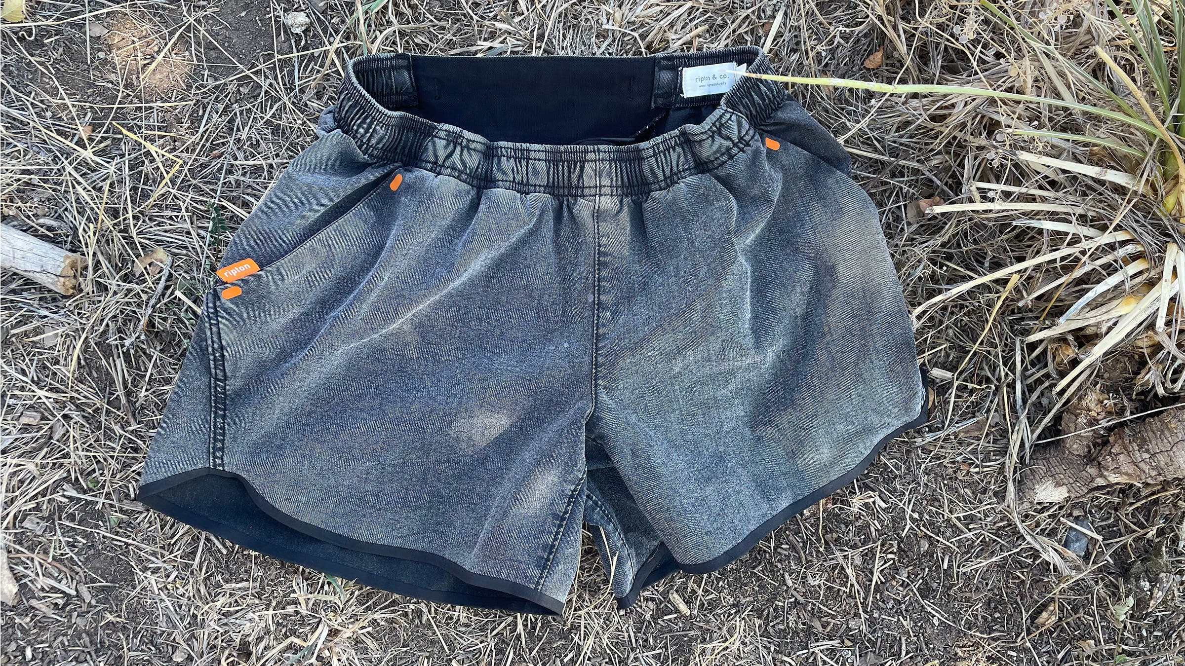 Ripton performance denim jorts on grassy background