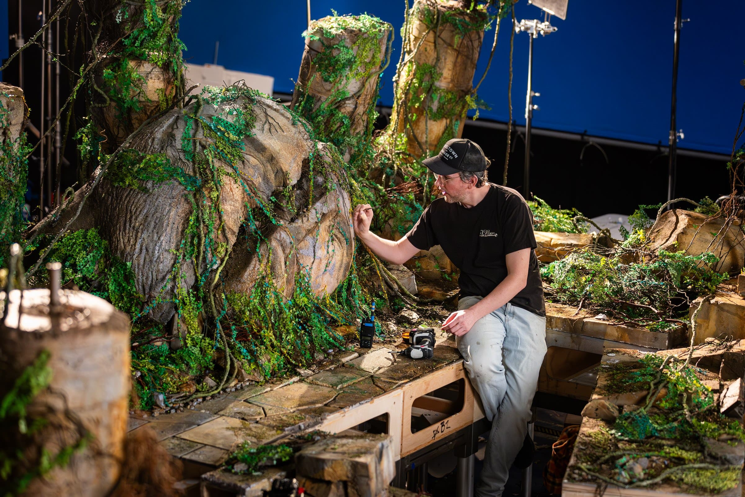 Painting the set of 'Wildwood' by hand