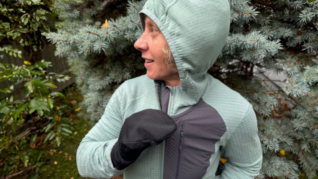 Outside tester wearing sage colored Ridge Merino Cloudripper Merino Grid Fleece Full-Zip Jacket