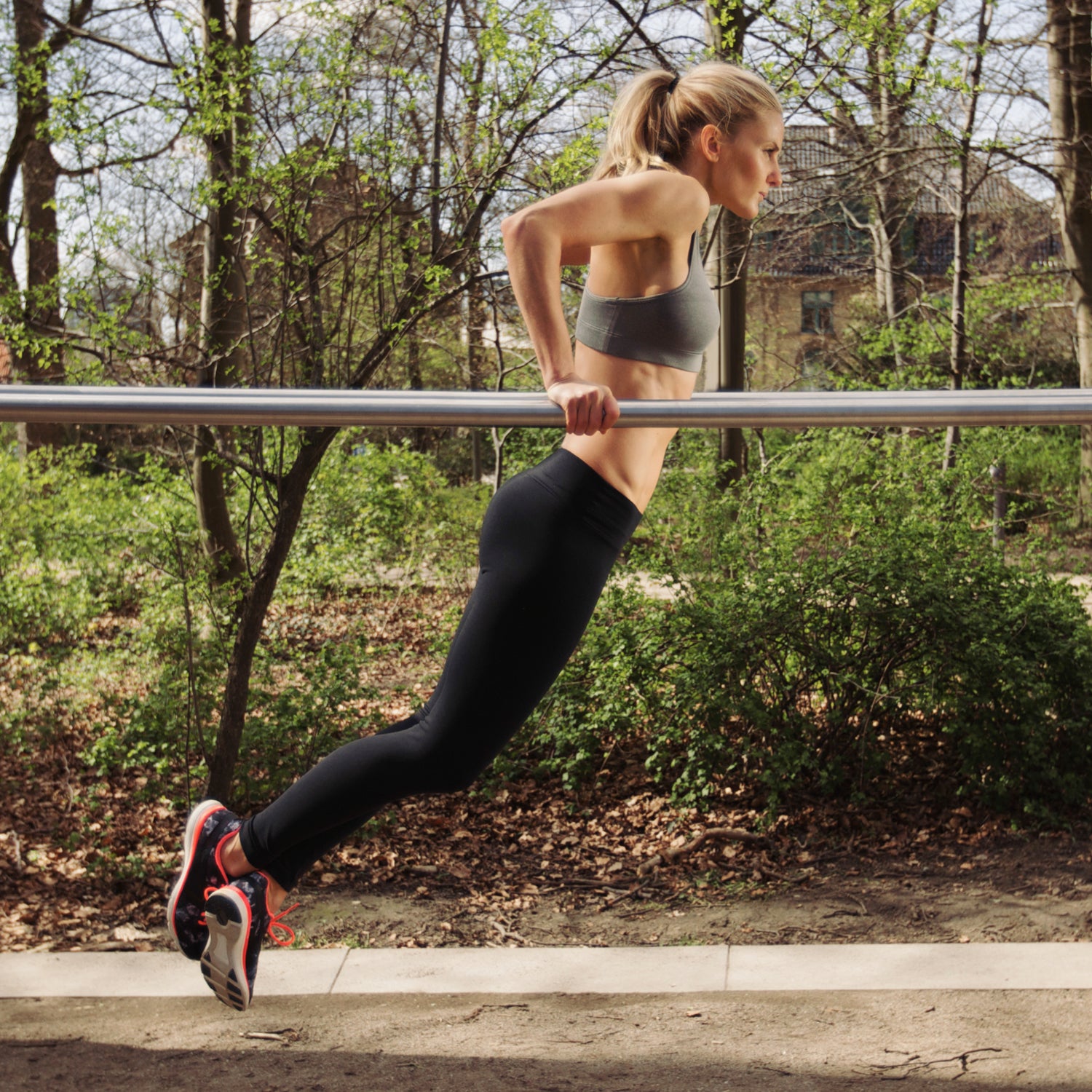 Premium Photo  Beautiful young woman in sports bra and leggings doing  stretching exercises during training in gym