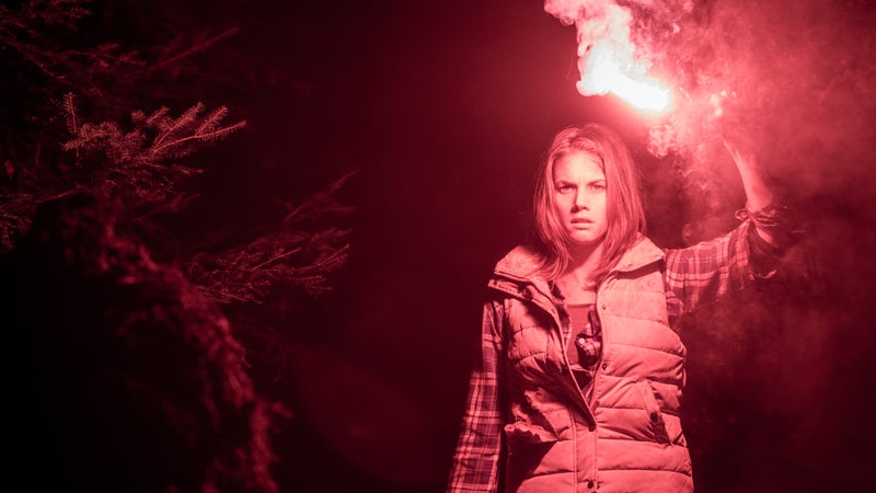Jen (actress Missy Peregrym) wanders in the wilderness at night in Backcountry.