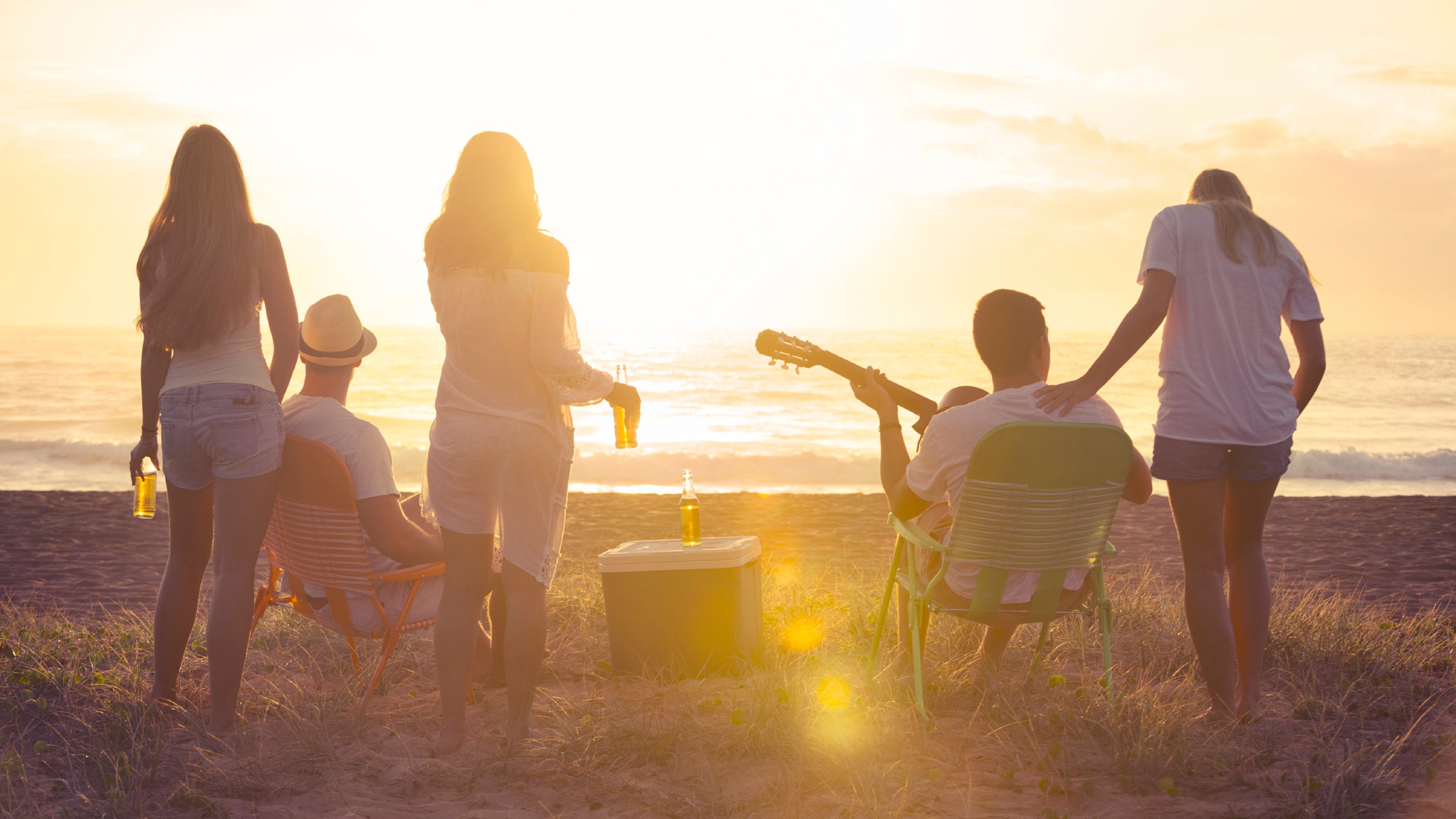 Sunset Party Guitar Beach Friendship Sunny Recreational Pursuit casual Horizontal Outdoors Back Lit Lifestyles Heterosexual Couple People Beach Party beer drinking surf not posing Casual Women Sea Sun authentic natural relaxed Summer Sunlight Tropical Climate Excitement Adults Only Group Of People sitting standing lens flare Small Group Of People Five People Photography looking carefree freedom Spring Break watching Music 20s Playing Happiness Enjoyment Fun Teenager Young Adult Couple