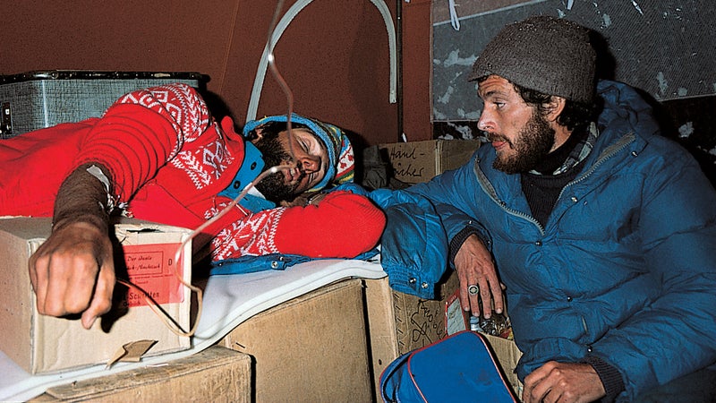 Peter Hackett, right, reinfusing a climber with plasma.