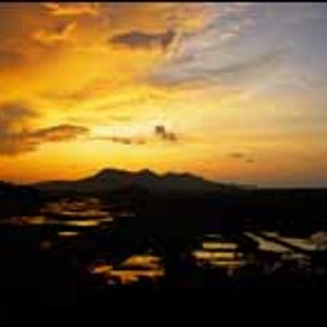 Night ride: the sun sets over Vietnam's mountains and rice paddies