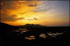 Night ride: the sun sets over Vietnam's mountains and rice paddies