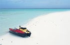 Modern-day Niña and Pinta: the author's and photographer's kayaks beached on Pulu Beras