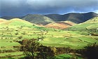 The road less pedaled: storm clouds approaching in the English countryside