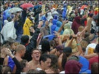 Rain Dance: The crowd can't get enough of the rain or Sheryl Crow.