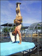 Jimmy Blakeney works his upper body atop a platform in the bike trials course.