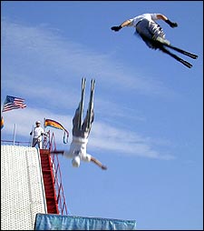 We don't need no stinkin' snow: Tommy DeAngelo and Lance Rouleau fly skyward after making jumps only seconds apart.