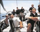 Stars and Stripes: With Ken Read at the helm, Team Dennis Conner launches into a practice race.