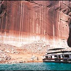 Half empty or half full? Houseboaters examine exposed Lake Powell shoreline
