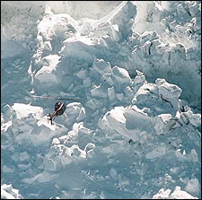 Aftershock: a copter surveys an avalanche in Rainier's Disappointment Cleaver.