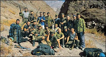 K-Team: Garth Willis (in blue) with Kyrgyz soldiers at the Forward Military Post in the Karavshin, October 2002