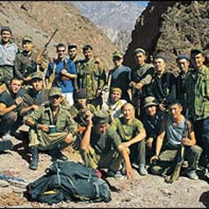 K-Team: Garth Willis (in blue) with Kyrgyz soldiers at the Forward Military Post in the Karavshin, October 2002